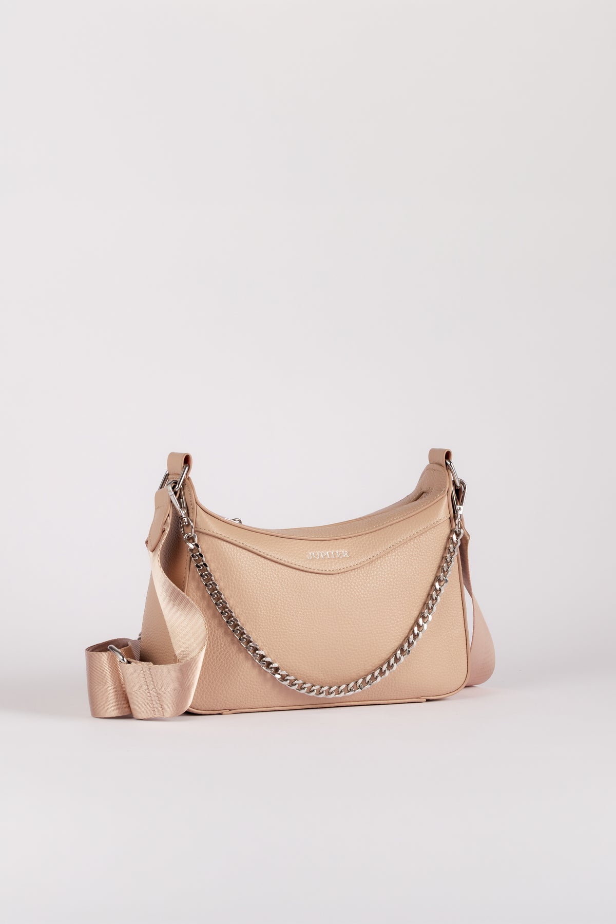 A light beige Jupiter leather shoulder bag with a silver chain strap and a matching wide fabric shoulder strap, set against a plain light gray background. The handbag comes with safety features such as anti theft zipper, slash proof material and RFID protection.
